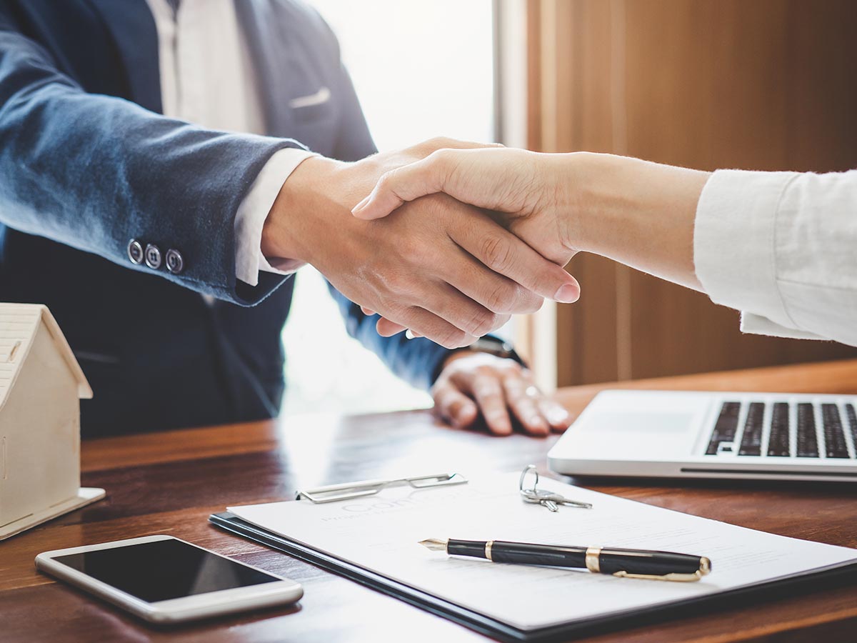 Man and woman shaking hands in an office