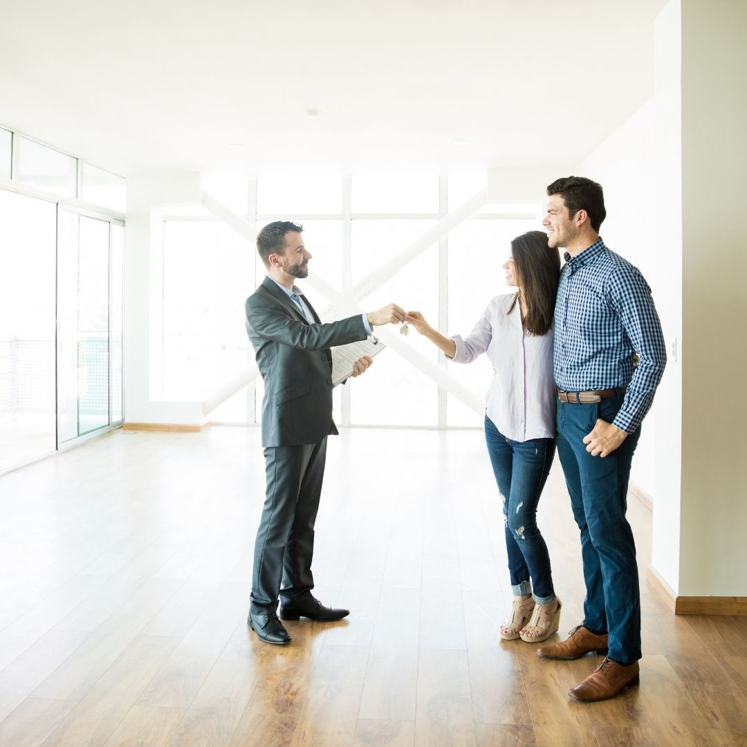 People closing a deal on a house.