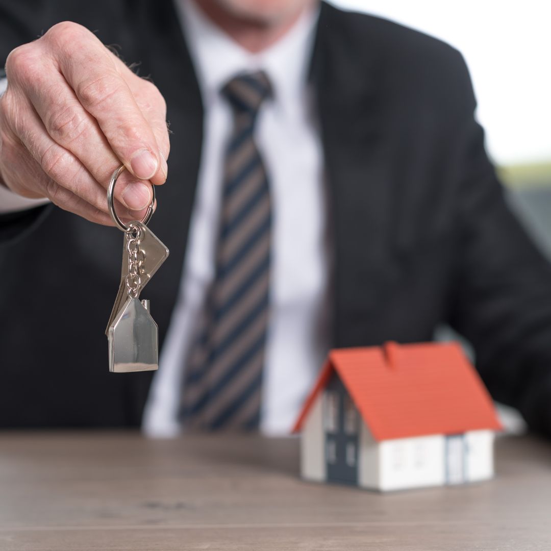 Hand handing keys