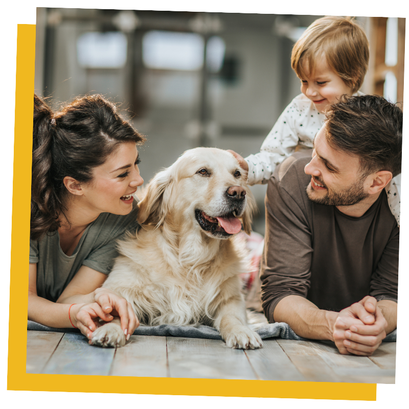 A happy family of three with their dog