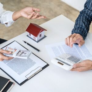 People discussing housing paperwork