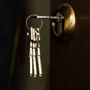 set of keys on ring in lock on door