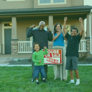 family celebrating buying a house